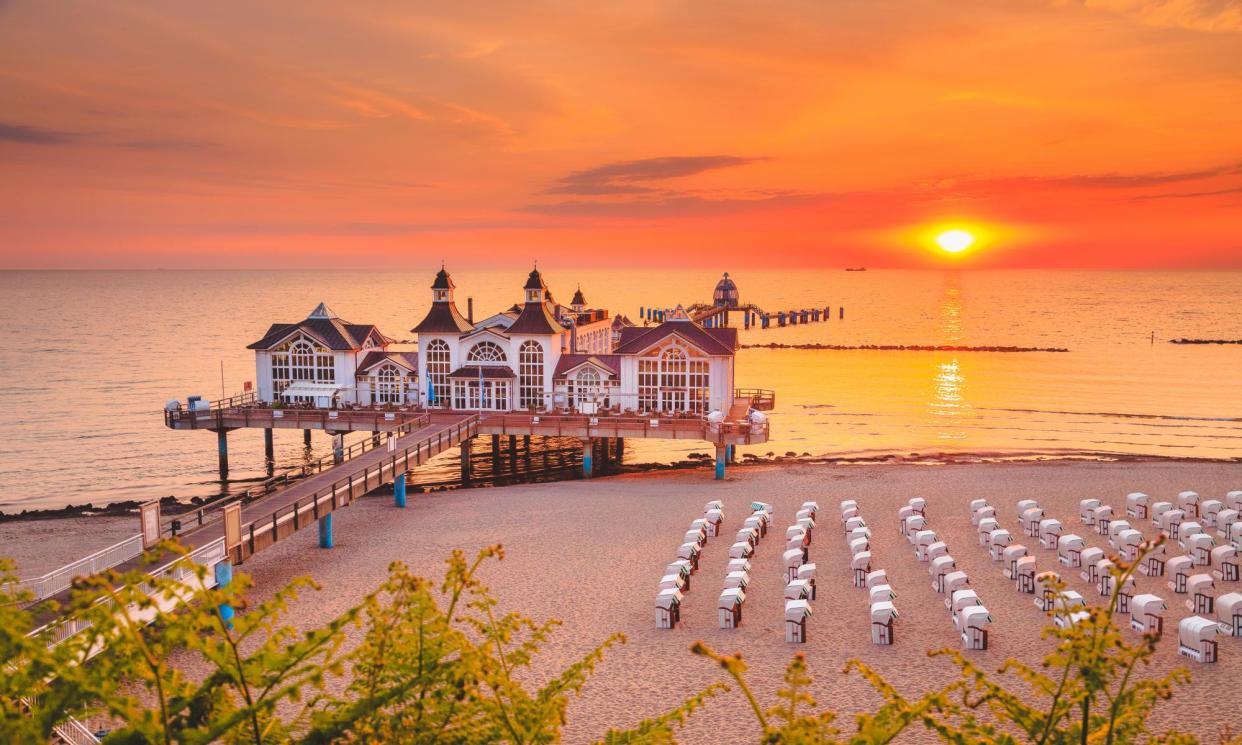 <span>Sellin Pier at sunrise, Baltic Sea, Germany.</span><span>Photograph: bluejayphoto/Getty Images</span>