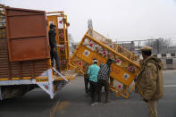 Police put up barricades on a major highway at Singhu near New Delhi to stop thousands of protesting farmers from entering the capital, India, Tuesday, Feb.13, 2024. Farmers, who began their march from northern Haryana and Punjab states, are asking for a guaranteed minimum support price for all farm produce. (AP Photo/Manish Swarup)