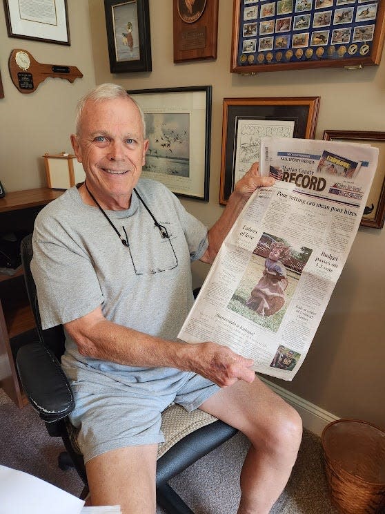 After purchasing a one-year subscription, columnist Sam Venable displays his initial copy of the Marion County (Kansas) Record.