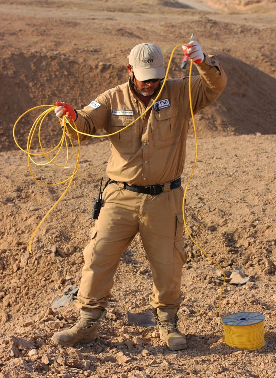 Just after dawn on Wednesday, the demining team rigs together the explosives it has collected in the previous week to detonate and destroy them behind the frontlines. The fortified positions are held by Kurdish Peshmerga forces. (Photo: Ash Gallagher for Yahoo News)