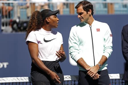 Mar 20, 2019; Miami Gardens, FL, USA; Serena Williams of the United States (L) speaks with Roger Federer of Switzerland (R) during a ribbon cutting ceremony on new stadium court at Hard Rock Stadium prior to play in the first round of the Miami Open at Miami Open Tennis Complex. Geoff Burke