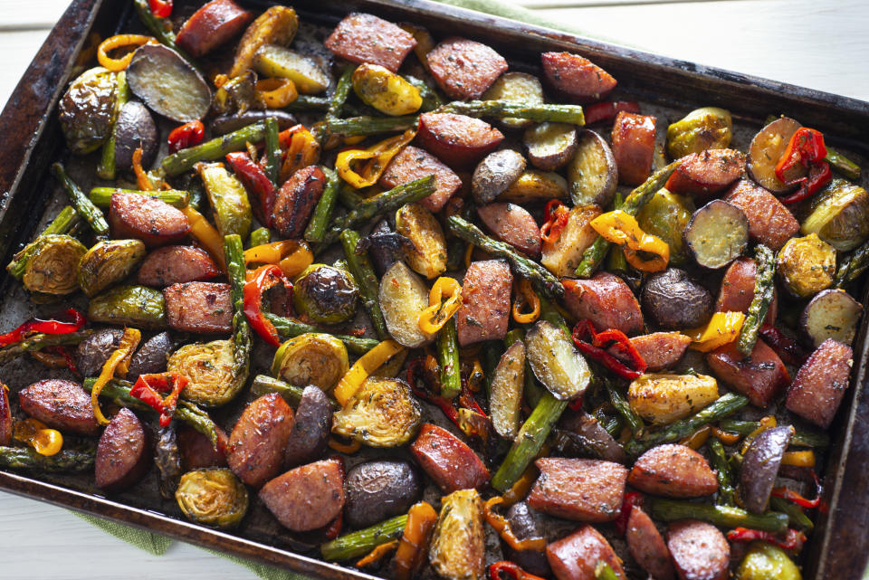 A bunch of roasted vegetables on a baking sheet.