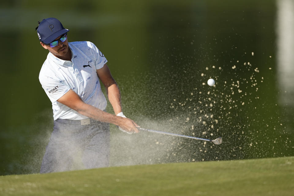 Rickie Fowler hits from the bunker on the 17th hole during first round of the Wells Fargo Championship golf tournament at the Quail Hollow Club on Thursday, May 4, 2023, in Charlotte, N.C. (AP Photo/Chris Carlson)