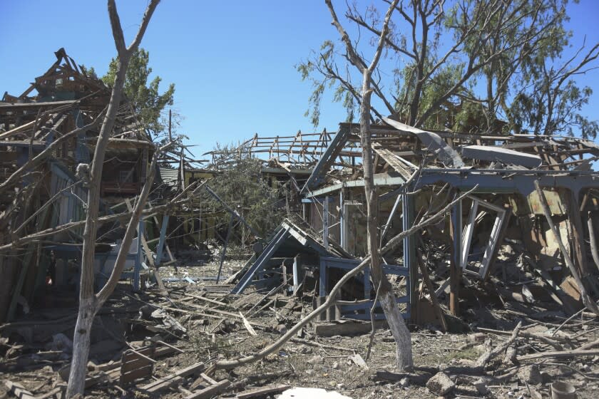 A view of apartment buildings destroyed by Russian shelling on the outskirts of Odesa, Ukraine, Tuesday, July 26, 2022. (AP Photo/Michael Shtekel)