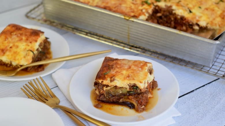 moussaka servings on white plates