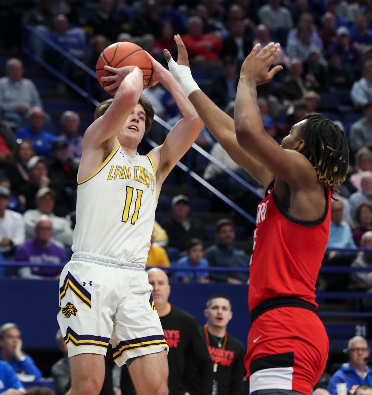 Lyon County's Travis Perry (11) shoots against Newport's Marquez Miller (5) during the Sweet 16 tournament at Rupp Arena in Lexington, Ky. on Mar. 16, 2023.