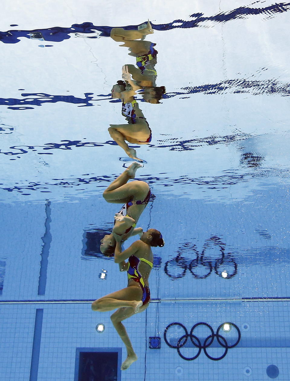 Marie-Pier Boudreau Gagnon and Elise Marcotte of Canada compete during women's duet synchronized swimming preliminary round at the Aquatics Centre in the Olympic Park during the 2012 Summer Olympics in London, Monday, Aug. 6, 2012. (AP Photo/Mark J. Terrill)