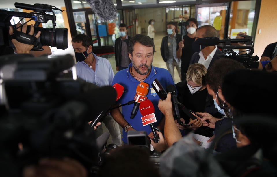 Right-wing opposition leader Matteo Salvini leaves a polling station, in Milan, Italy, Monday, Sept. 21, 2020. On Sunday and Monday Italians are called to vote nationwide in a referendum to confirm a historical change to the country's constitution to drastically reduce the number of Members of Parliament from 945 to 600. Eighteen million of Italian citizens will also vote on Sunday and Monday to renew local governors in seven regions, along with mayors in approximately 1,000 cities. (AP Photo/Antonio Calanni)