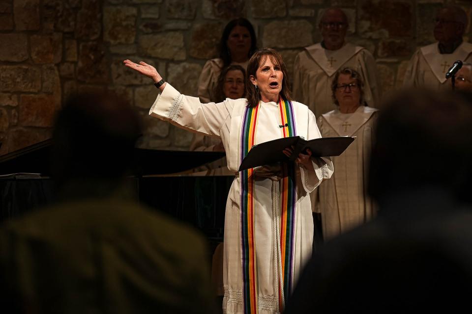 Pastor Tracy Beadle reads to the congregation during a Sunday service at Westlake United Methodist Church on Sunday, May 5, 2024.