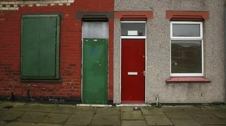 A painted red door of a house is seen on a terraced street in the Gresham area of Middlesbrough, northern Britain, January 20, 2016. REUTERS/Phil Noble
