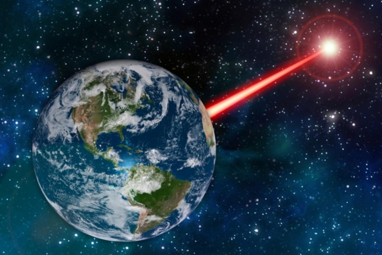 An MIT researcher claims a laser space beacon detectable up to 20,000 light years away (MIT)