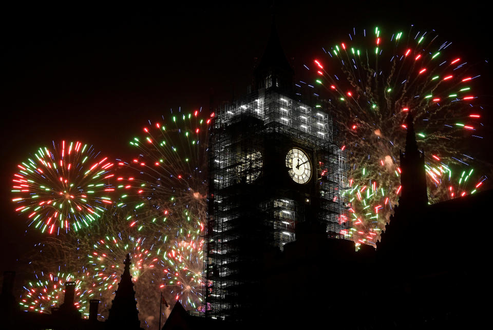 Fireworks explode behind Big Ben during New Year's celebrations in London on January 1, 2018. (Photo: Toby Melville / Reuters)