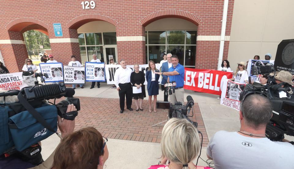 Attorney John Phillips speaks to the media as he stands with Alexander Bello-Ortiz's parents, his investigator and many supporters, Monday, March 27, 2023, during a press conference in front of the Daytona Beach Police Department.