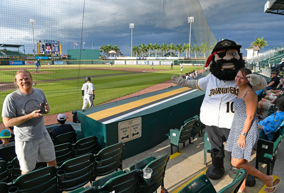 Karen McQueen with Marty the Marauder mascot as John Maly, of Sarasota, gets a snapshot in 2022. Marauders Pride Night is Saturday.