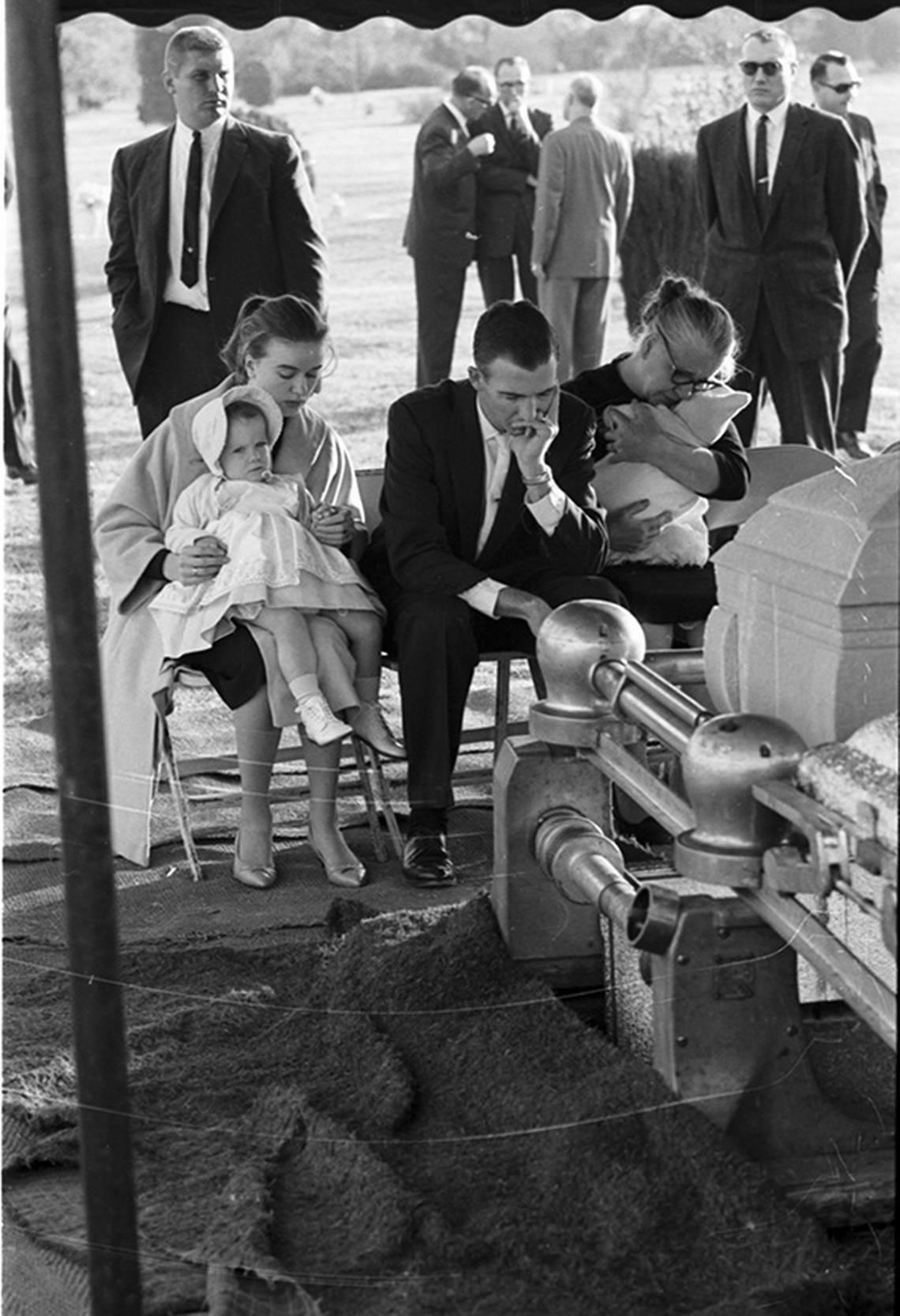 Nov. 25, 1963: Lee Harvey Oswald funeral, Fort Worth’s Rose Hill Cemetery; Oswald’s family at gravesite: wife, Marina with young daughter, brother R.L. Oswald of Denton, and mother Marguerite Oswald with baby.