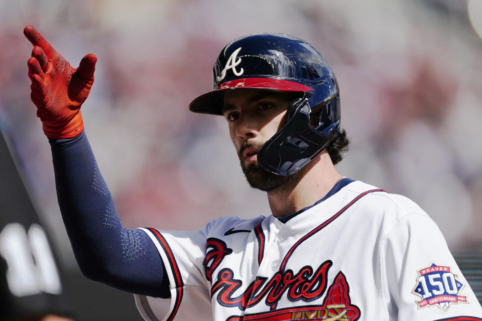 Atlanta Braves shortstop Dansby Swanson (7) reacts after a base hit during the fifth inning of Game 3 of a baseball National League Division Series against the Milwaukee Brewers, Monday, Oct. 11, 2021, in Atlanta. (AP Photo/John Bazemore)