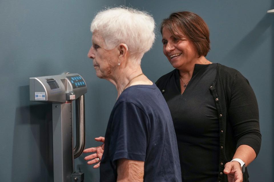 Patient Amelia Douglas steps on the scale during her check up with Dr. Cathy Castillo at Austin Regional Clinic's Senior Care clinic. Now is the time for all Medicare recipients to renew their care coverage. This year seniors should expect to pay more a month for their benefits.