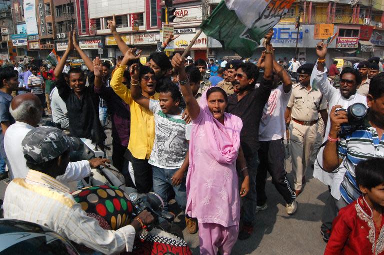 Indian opposition activists demonstrate against the deaths of women who were sterilised in a government-run programme, during a rally in Raipur on November 12, 2014