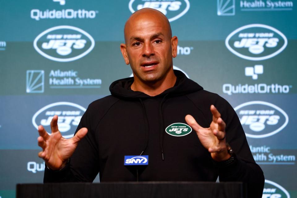 A Lebanese man wearing a black hoodie with a New York Jets patch on it stands at a podium. Rich Schultz/Getty Images