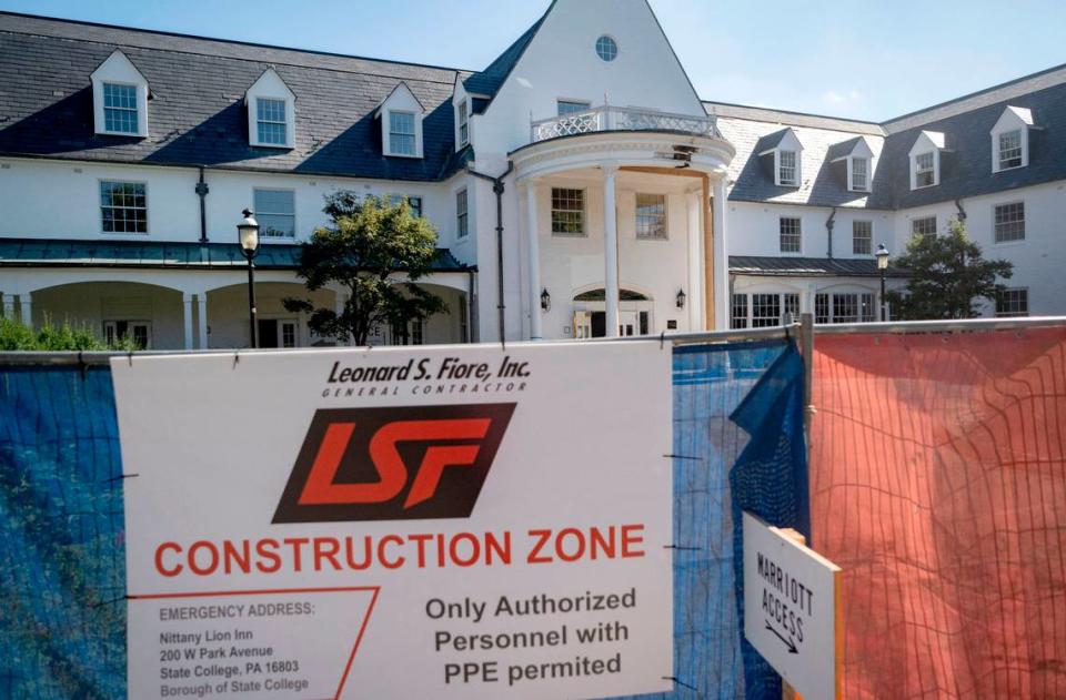 Construction fences surround the Nittany Lion Inn as renovations are happening on Monday, Oct. 4, 2023.