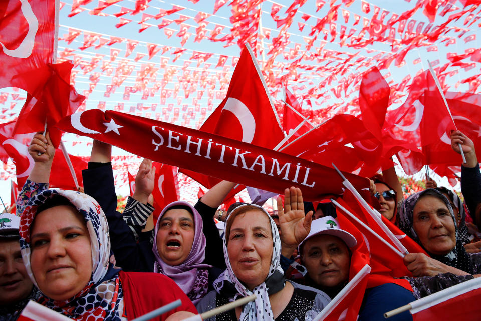 People wave national flags