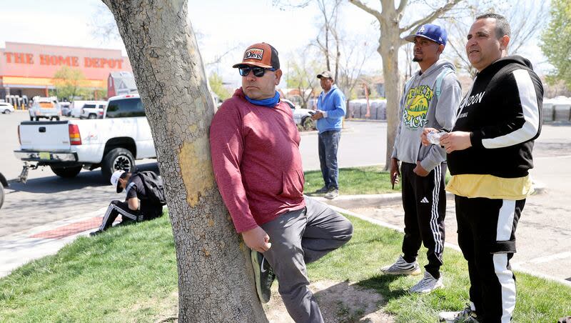 Men wait for work opportunities near Home Depot in West Valley City on Tuesday. Undocumented immigrants in Utah sometimes gather outside places like Home Depot seeking work, drawing fire from some.