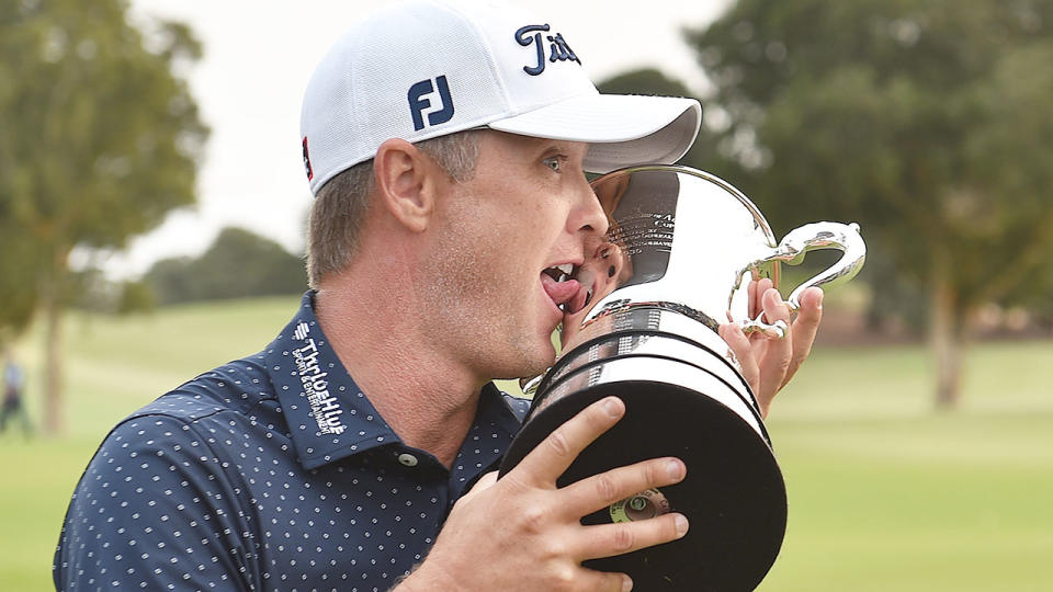 Seen here, Matt Jones poses with the trophy after winning the men's Australian Open golf tournament in 2019. 