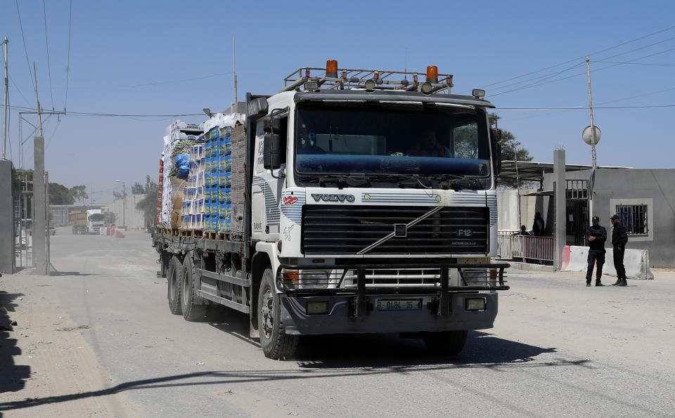 A truck carrying fruits and vegetables enters Gaza at the Kerem Shalom cargo crossing with Israel, in Rafah, southern Gaza Strip, Monday, June 21, 2021. Israel on Monday eased some restrictions on the Gaza Strip that have threatened a fragile cease-fire which halted an 11-day war last month with the territory's Hamas rulers, Palestinian officials said. (AP Photo/Adel Hana)