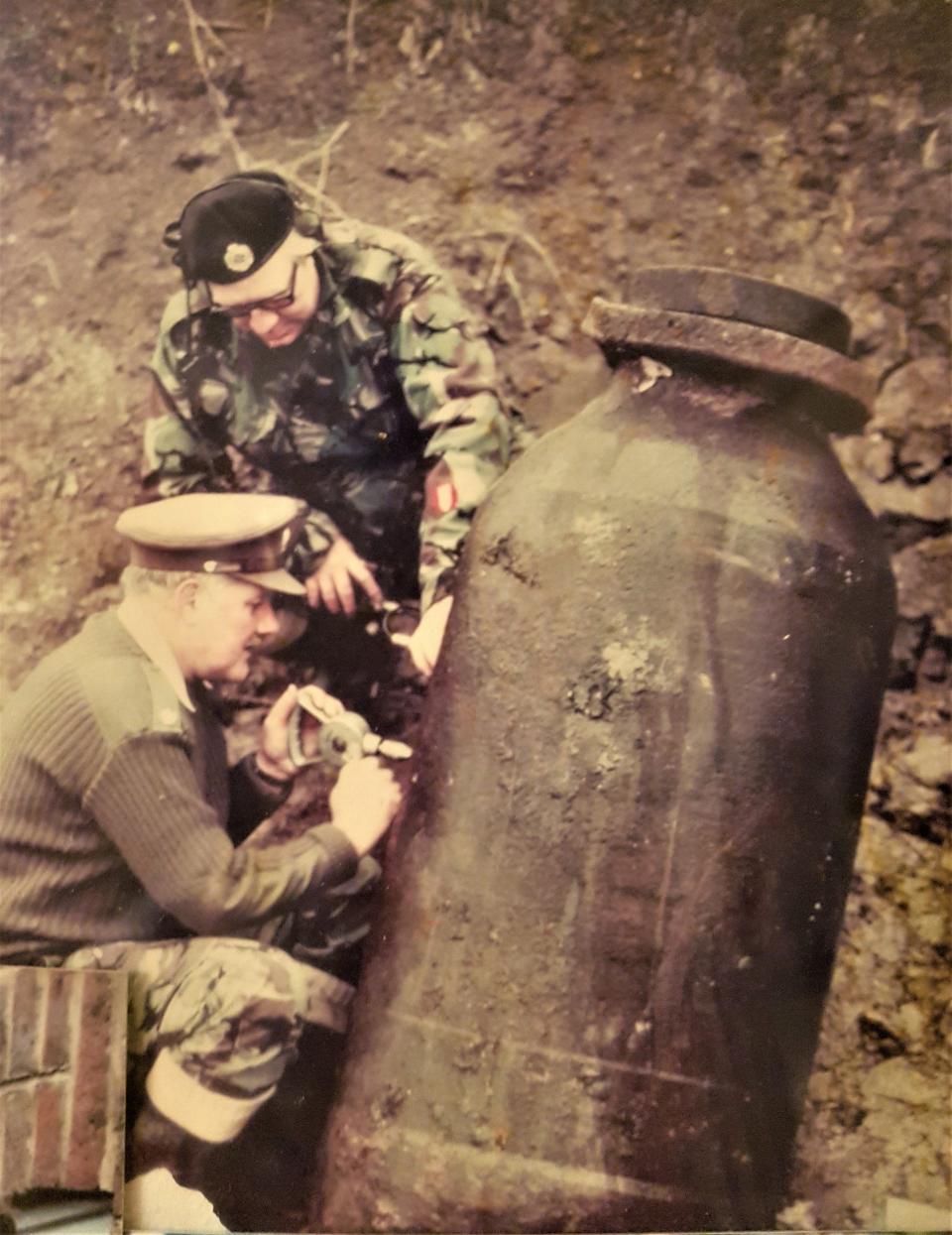 Hogben at Rainham in Essex in December 1975 using a hand drill to gain access to the fuze of a 1,000kg Hermann bomb similar to the one involved in the 1974 episode which gained him his medal - Courtesy of family