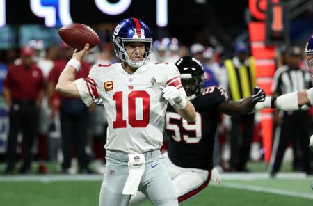 Oct 22, 2018; Atlanta, GA, USA; New York Giants quarterback Eli Manning (10) attempts a pass in the first quarter against the Atlanta Falcons at Mercedes-Benz Stadium. Mandatory Credit: Jason Getz-USA TODAY Sports