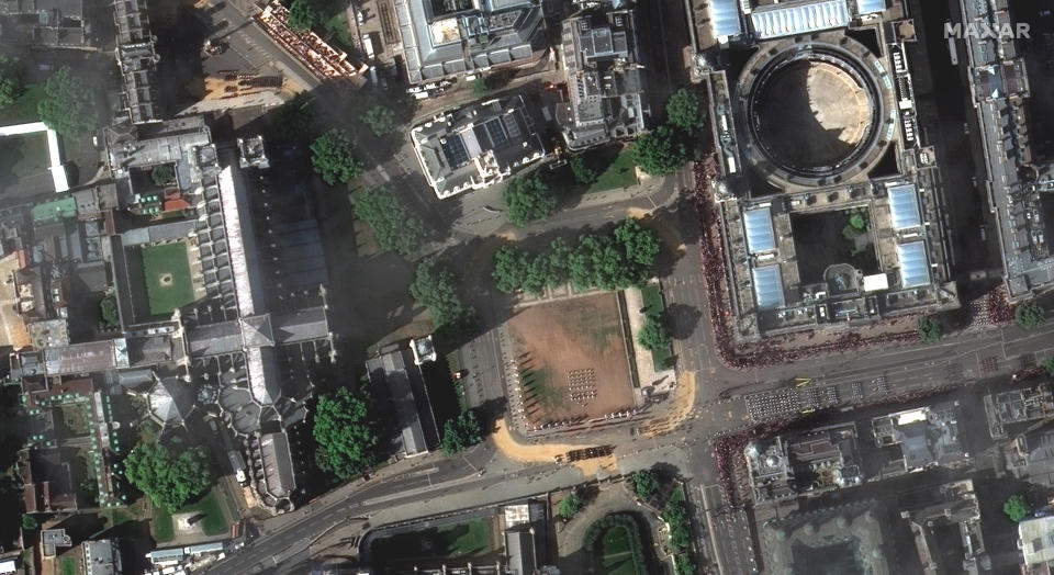 This satellite image provided by Maxar Technologies shows an overview of people gathered for the funeral procession of Queen Elizabeth II in London, Monday, Sept. 19, 2022. (Satellite image ©2022 Maxar Technologies via AP)