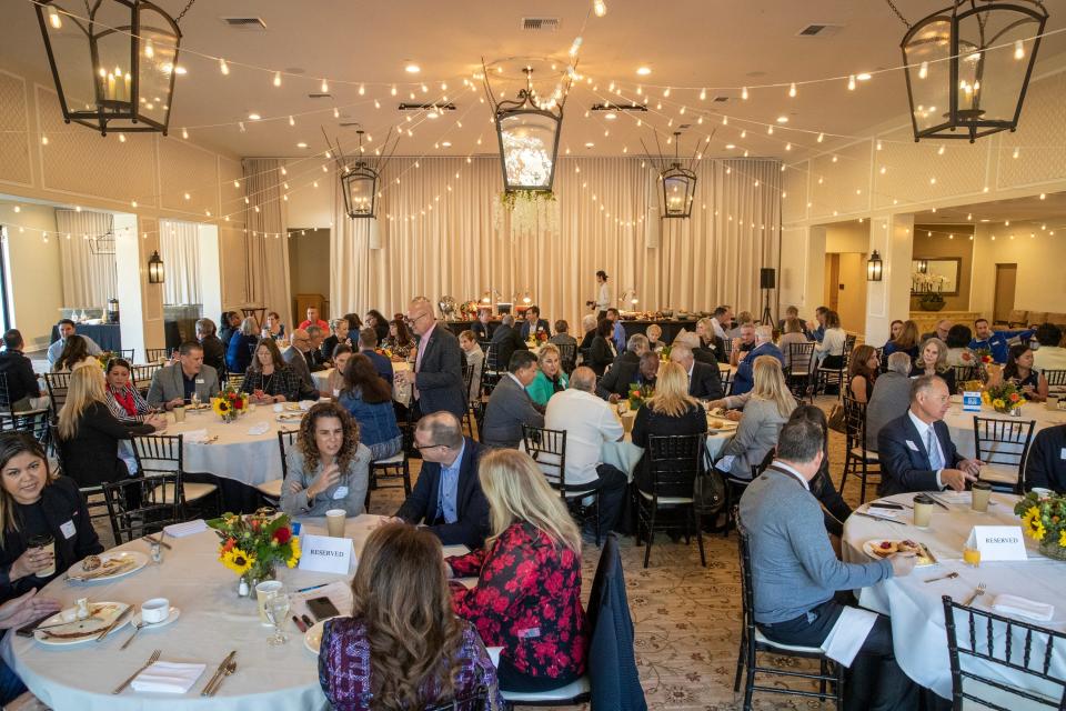 People representing one of 37 nonprofit organizations to receive donations through Impact Through Golf attend The American Express Helping Hands breakfast at the La Quinta Country Club in La Quinta, Calif., on Nov. 17, 2022. 