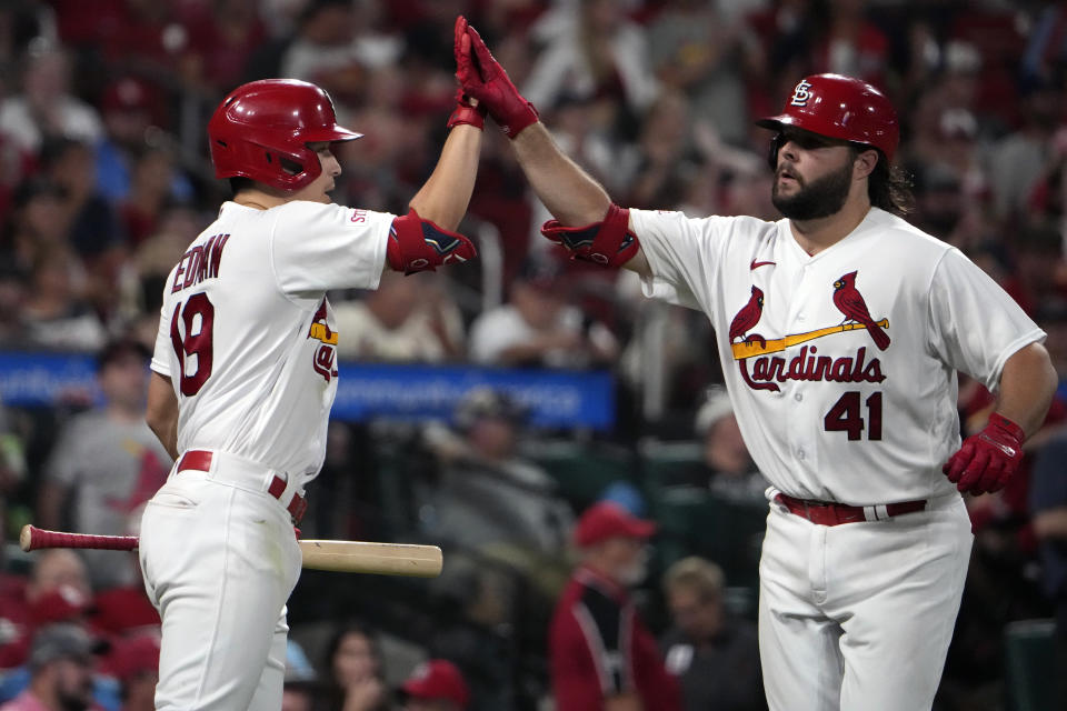 St. Louis Cardinals' Alec Burleson (41) is congratulated by teammate Tommy Edman (19) after hitting a solo home run during the sixth inning of a baseball game against the Minnesota Twins Thursday, Aug. 3, 2023, in St. Louis. (AP Photo/Jeff Roberson)