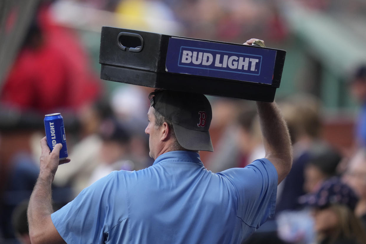 A Bud Light beer vendor during a baseball game at Fenway Park, Tuesday, May 30, 2023, in Boston. (AP Photo/Charles Krupa)