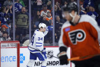 Toronto Maple Leafs' Auston Matthews celebrates after scoring a goal during the third period of an NHL hockey game against the Philadelphia Flyers, Thursday, March 14, 2024, in Philadelphia. (AP Photo/Matt Slocum)