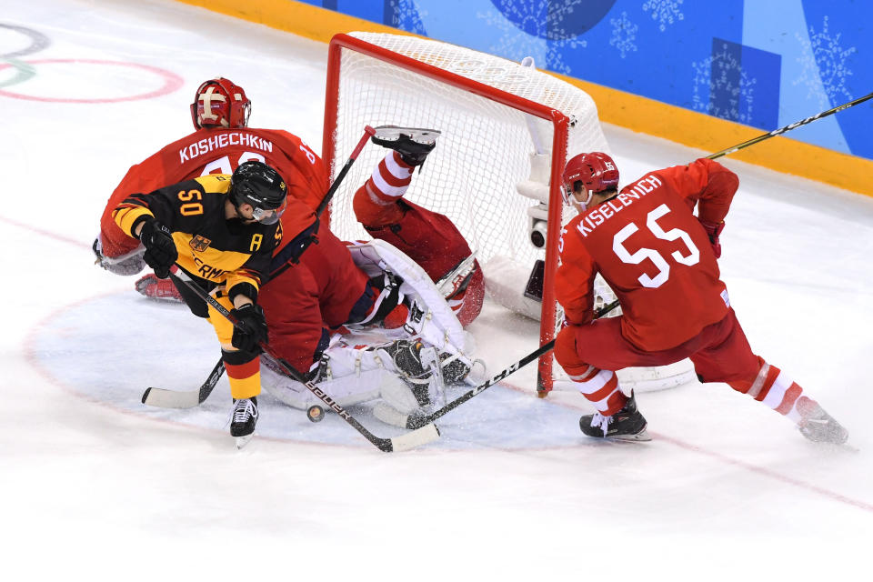 <p>Patrick Hager #50 of Germany attempts a shot against Vasili Koshechkin #83 and Bogdan Kiselevich #55 of Olympic Athlete from Russia in the third period during the Men’s Gold Medal Game on day sixteen of the PyeongChang 2018 Winter Olympic Games at Gangneung Hockey Centre on February 25, 2018 in Gangneung, South Korea. (Photo by Harry How/Getty Images) </p>