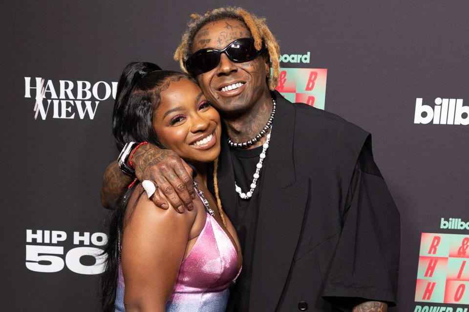 <p>Brandon Todd/Billboard via Getty</p> Reginae Carter and Lil Wayne at Billboard R&B Hip-Hop Live held at The Novo on August 8, 2023 in Los Angeles, California.