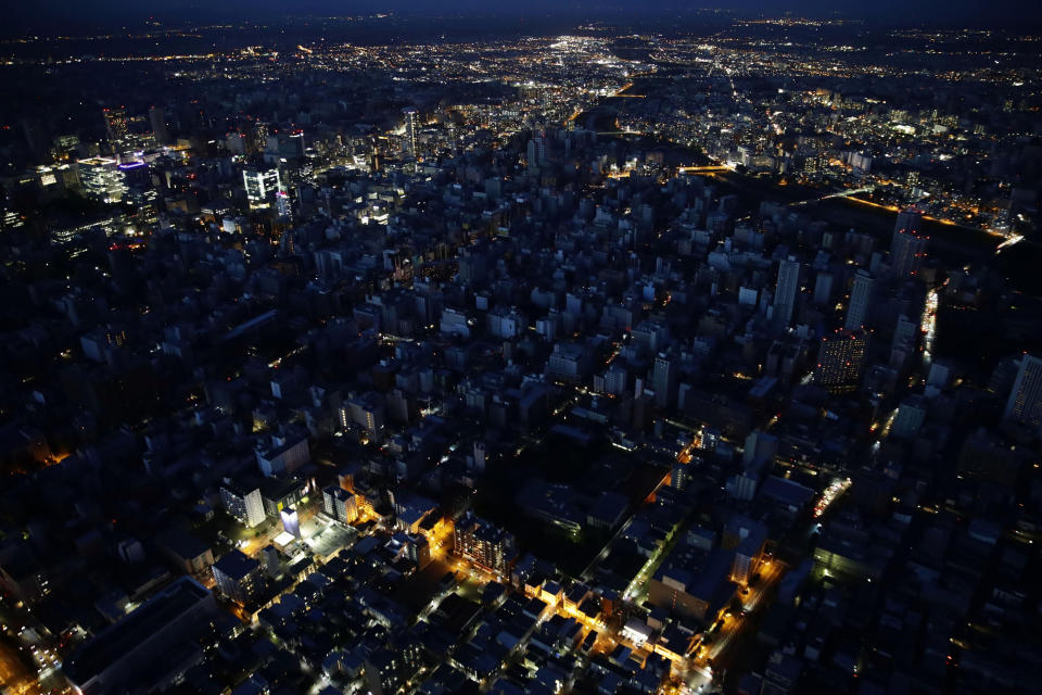 <p>Lights are off at central Sapporo, Hokkaido, northern Japan Thursday, Sept. 6, 2018. A powerful earthquake jolted Japan’s northernmost main island of Hokkaido, buckling roads, knocking homes off their foundations and causing entire hillsides to collapse. (Photo: Hiroki Yamauchi/Kyodo News via AP) </p>