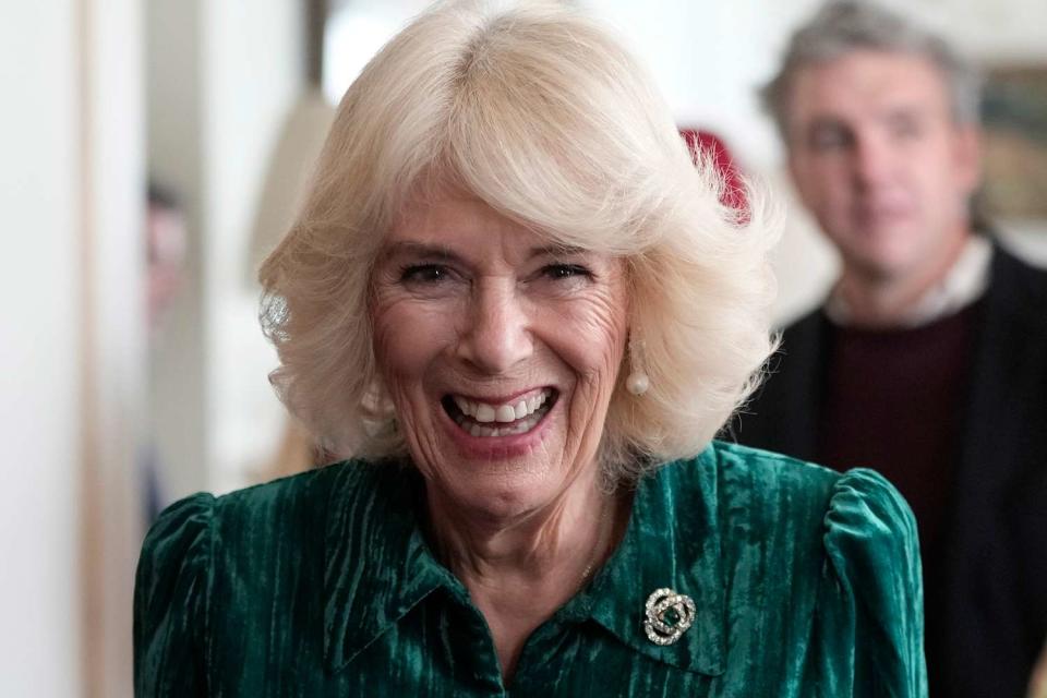 <p>Kin Cheung WPA Pool/Getty</p> Queen Camilla arrives at the tree decorating event at Clarence House on Dec. 6.