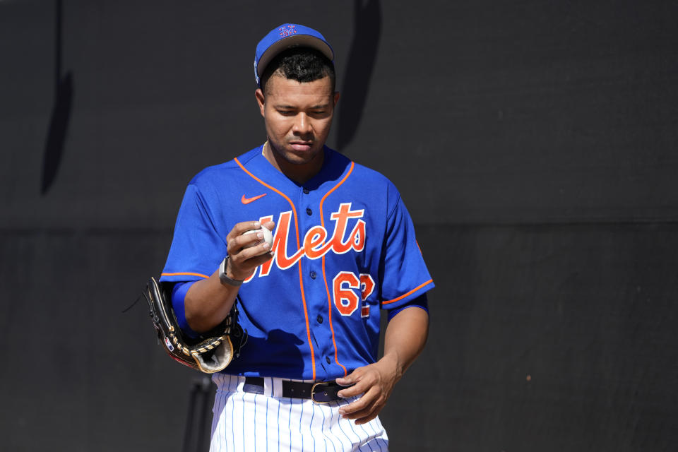 New York Mets pitcher Jose Quintana pauses during spring training baseball practice Monday, Feb. 20, 2023, in Port St. Lucie, Fla. (AP Photo/Jeff Roberson)