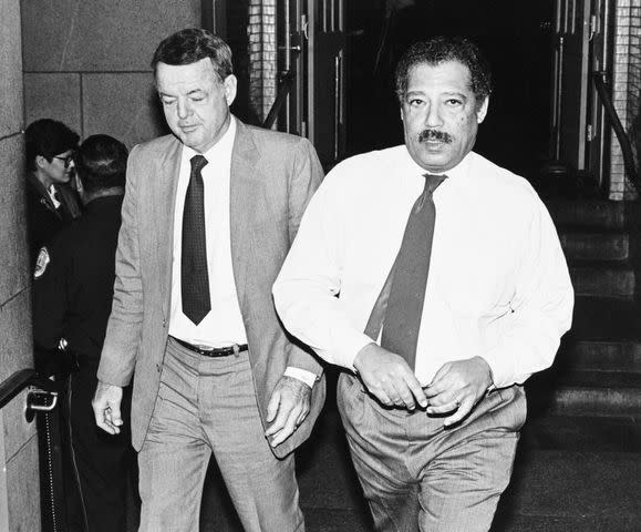 <p>Laura Patterson/CQ Roll Call via AP</p> Michael J. "Ozzie" Myers (D-PA), standing on the left, walks beside House Ethics Chair Julian Dixon in 1989