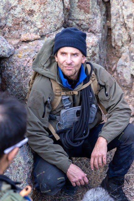 Bradley Cooper dove into "Running Wild." He even dressed like Bear Grylls.