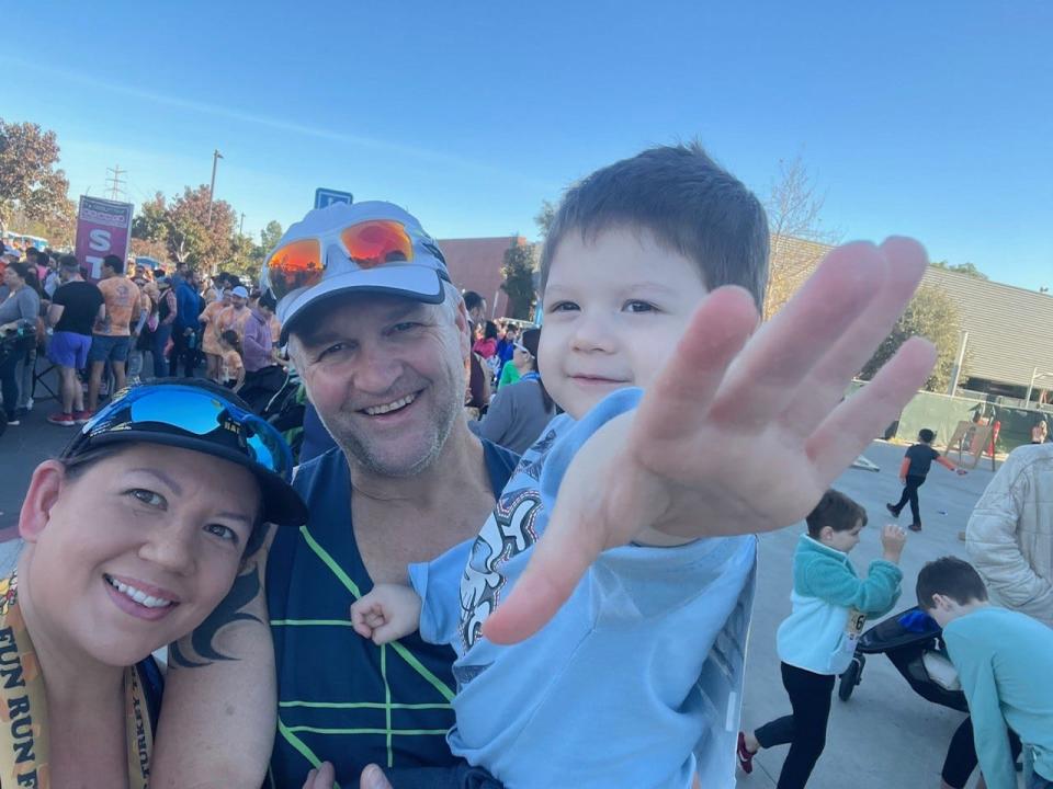 LiAnn and Mike Anderson at a running event with their three-year-old son, Declan.