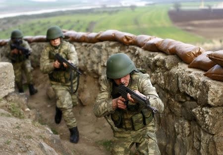 Turkish soldiers participate in an exercise on the border line between Turkey and Syria near the southeastern city of Kilis, Turkey, March 2, 2017. REUTERS/Murad Sezer