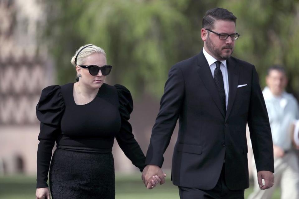 From left: Meghan McCain and her husband, Ben Domenech, at her dad's memorial in Arizona | Justin Sullivan/Getty