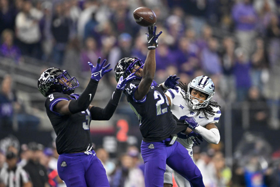 Dec 3, 2022; Arlington, TX, USA; TCU Horned Frogs cornerback Josh Newton (24) and safety Mark Perry (3) break up a pass intended for Kansas State Wildcats wide receiver Phillip Brooks (8) during the first quarter at AT&T Stadium. Mandatory Credit: Jerome Miron-USA TODAY Sports