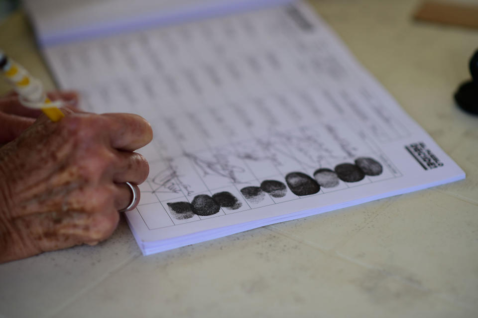 <p>A woman votes in Caracas on July 16, 2017 in an opposition-organized vote to measure public support for Venezuelan President Nicolas Maduro’s plan to rewrite the constitution. (Ronaldo Schemidt/AFP/Getty Images) </p>