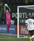 Portland Timbers goalkeeper Steve Clark makes a save against the Vancouver Whitecaps during the first half of an MLS soccer match in Portland, Ore., Wednesday, Oct. 20, 2021. (AP Photo/Steve Dipaola)