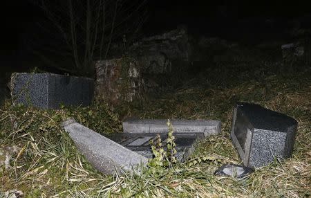 Desecrated tombstones are seen at Sarre-Union Jewish cemetery, eastern France, February 15, 2015. REUTERS/Vincent Kessler