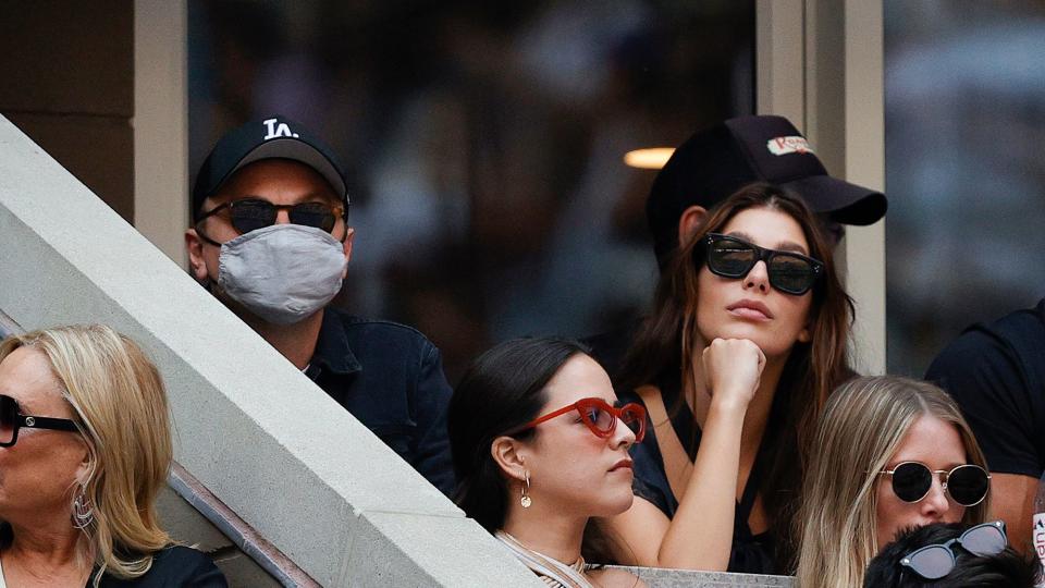 Leonardo DiCaprio and his girlfriend, model/actress, Camila Morrone watch the Men's Singles final match between Daniil Medvedev of Russia and Novak Djokovic of Serbia on Day Fourteen of the 2021 US Open at the USTA Billie Jean King National Tennis Center on September 12, 2021 in the Flushing neighborhood of the Queens borough of New York City